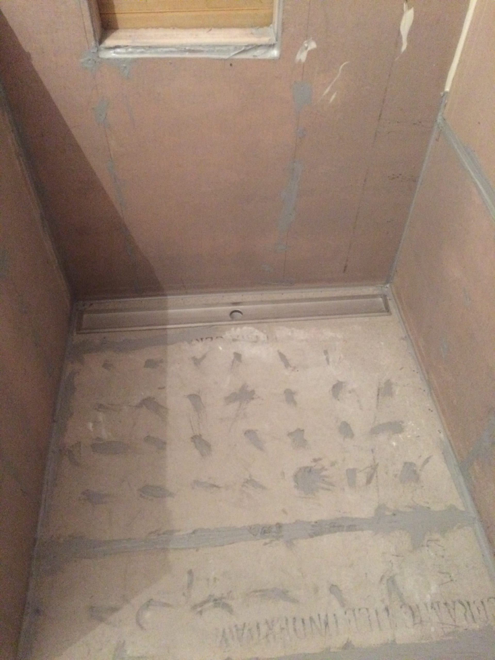 shower-floor-cement-sheet-and-caulking